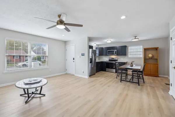 a view of a dining room with furniture window and wooden floor