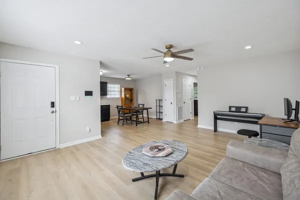 a living room with furniture and a rug