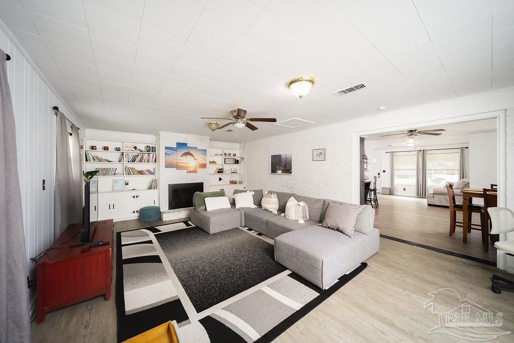 6841 Data Street Pensacola, FL 32504 - Photo 11 of 25 a living room with furniture and a couch