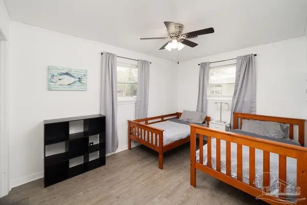 a bedroom with furniture and a window
