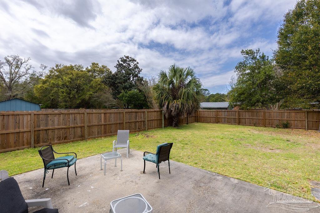6841 Data Street Pensacola, FL 32504 - Photo 20 of 25 a swimming pool with outdoor seating and yard