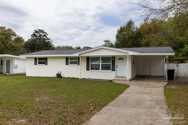 front view of a house with a yard