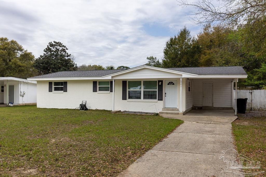6841 Data Street Pensacola, FL 32504 - Photo 2 of 25 front view of a house with a yard