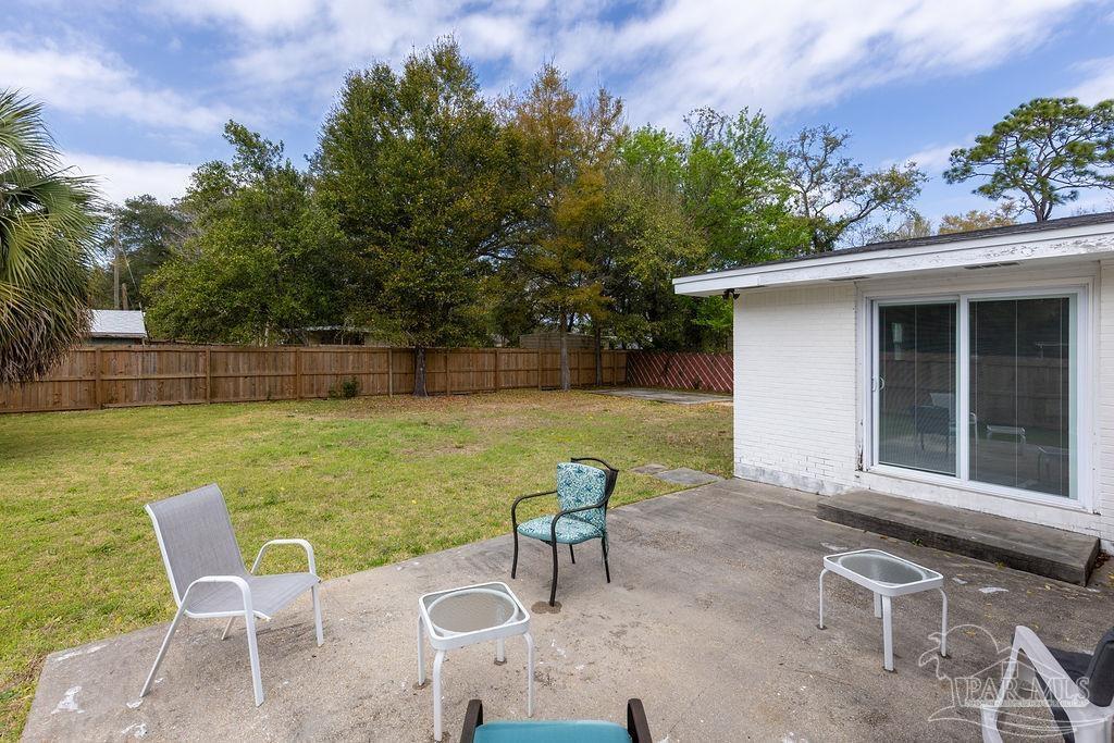 6841 Data Street Pensacola, FL 32504 - Photo 21 of 25 a view of a chair and table on the terrace