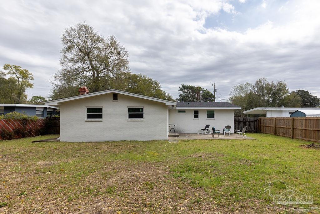 6841 Data Street Pensacola, FL 32504 - Photo 23 of 25 a house with trees in the background