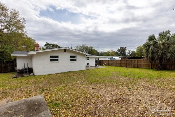 a view of a backyard with a house