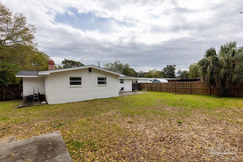 6841 Data Street Pensacola, FL 32504 - Photo 24 of 25 a view of a backyard with a house