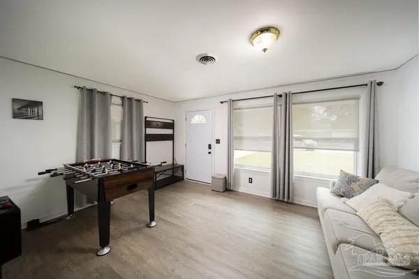a living room with furniture and a large window