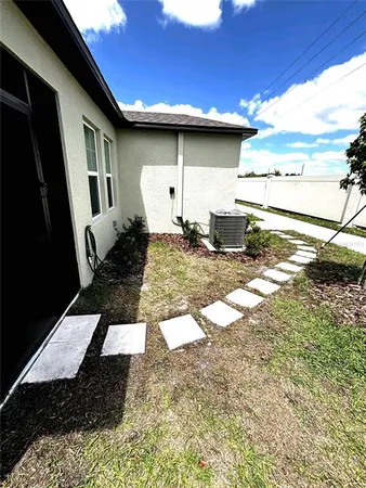a view of a back yard of the house