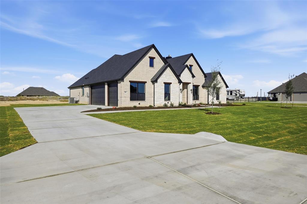 108 Rocky Top Azle, TX 76020 - Photo 2 of 40 a view of a house with a big yard and large trees