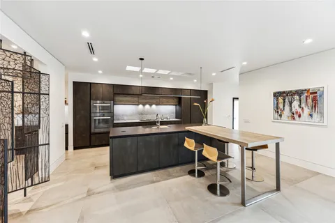 a view of a dining room with furniture and window