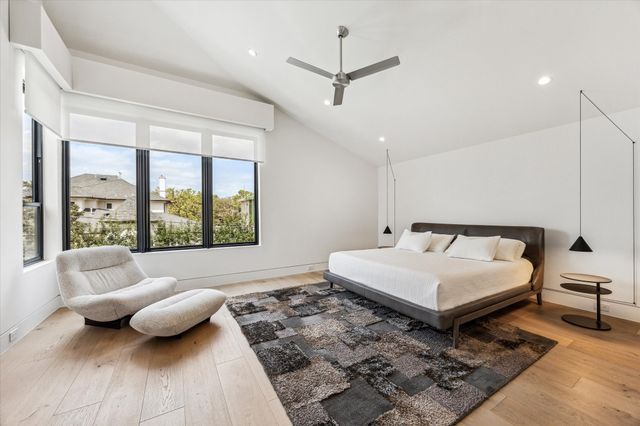 a view of a room with a wooden floor and a window