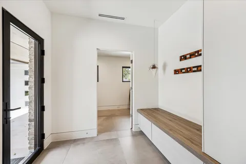 a bathroom with a double vanity sink toilet and shower