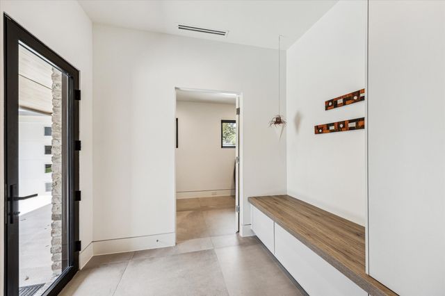 a bathroom with a double vanity sink toilet and shower