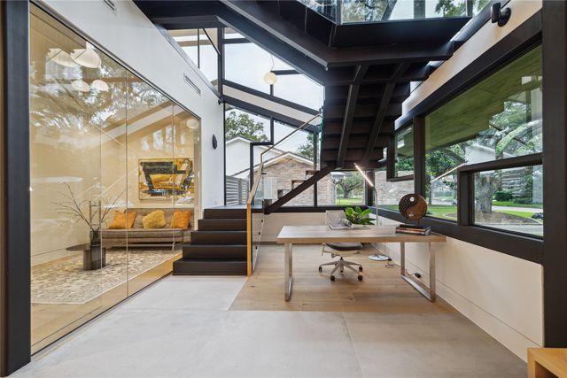 a living room with large windows