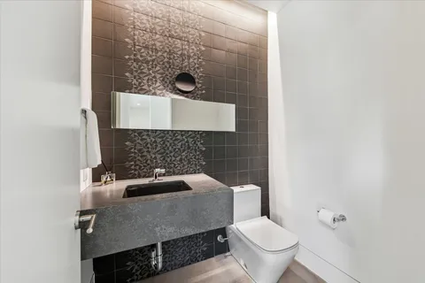 a bathroom with a toilet and a sink