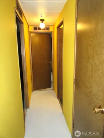 a view of an empty room with a window