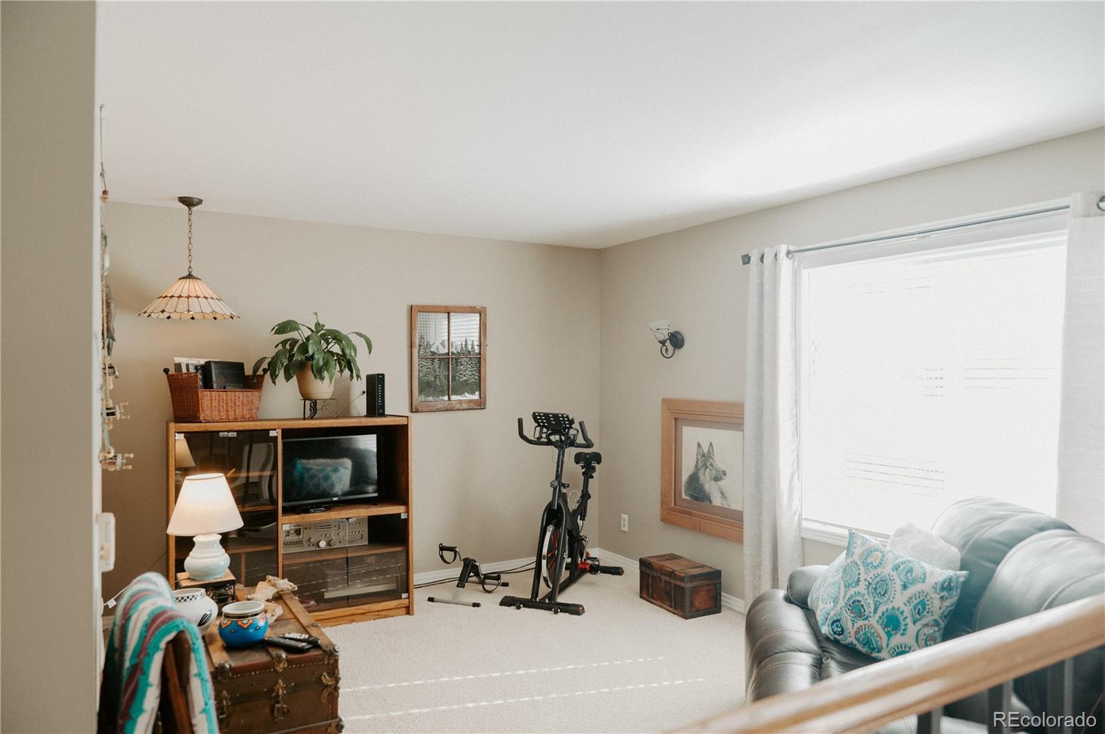 10340 West 100th Place Westminster, CO 80021 - Photo 13 of 25 a view of a workspace with furniture and a window