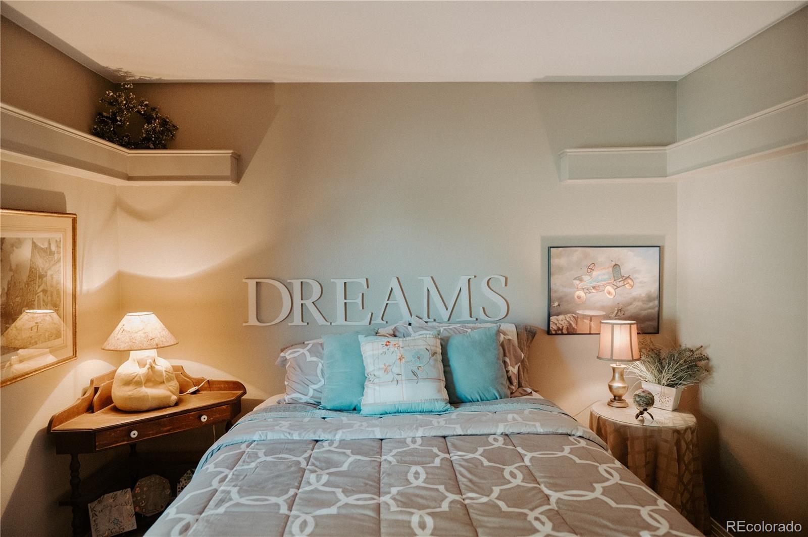 10340 West 100th Place Westminster, CO 80021 - Photo 15 of 25 a bedroom with a bed and window