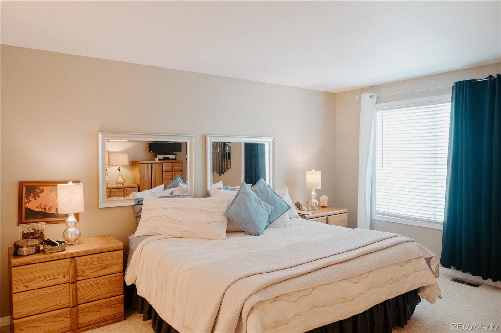 10340 West 100th Place Westminster, CO 80021 - Photo 19 of 25 a bedroom with a large bed and a window