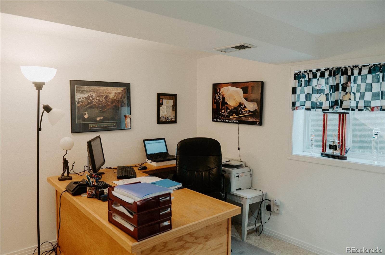 10340 West 100th Place Westminster, CO 80021 - Photo 22 of 25 a view of a workspace with furniture and a window