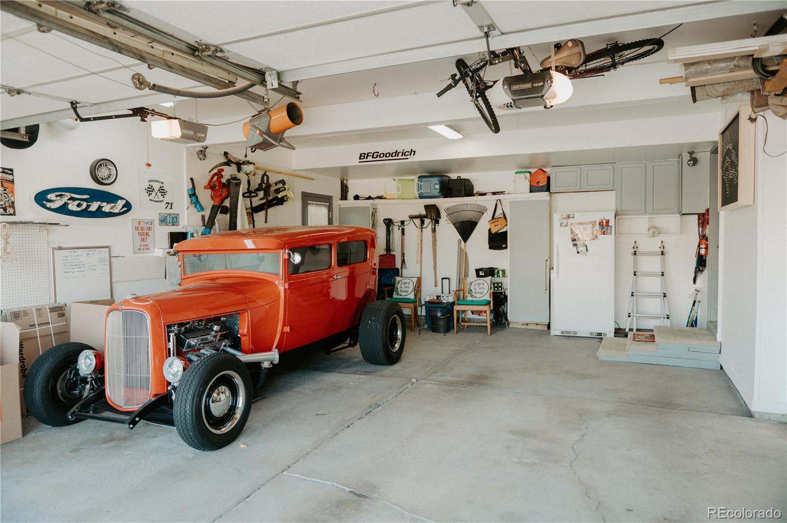 10340 West 100th Place Westminster, CO 80021 - Photo 23 of 25 a car and bike in garage