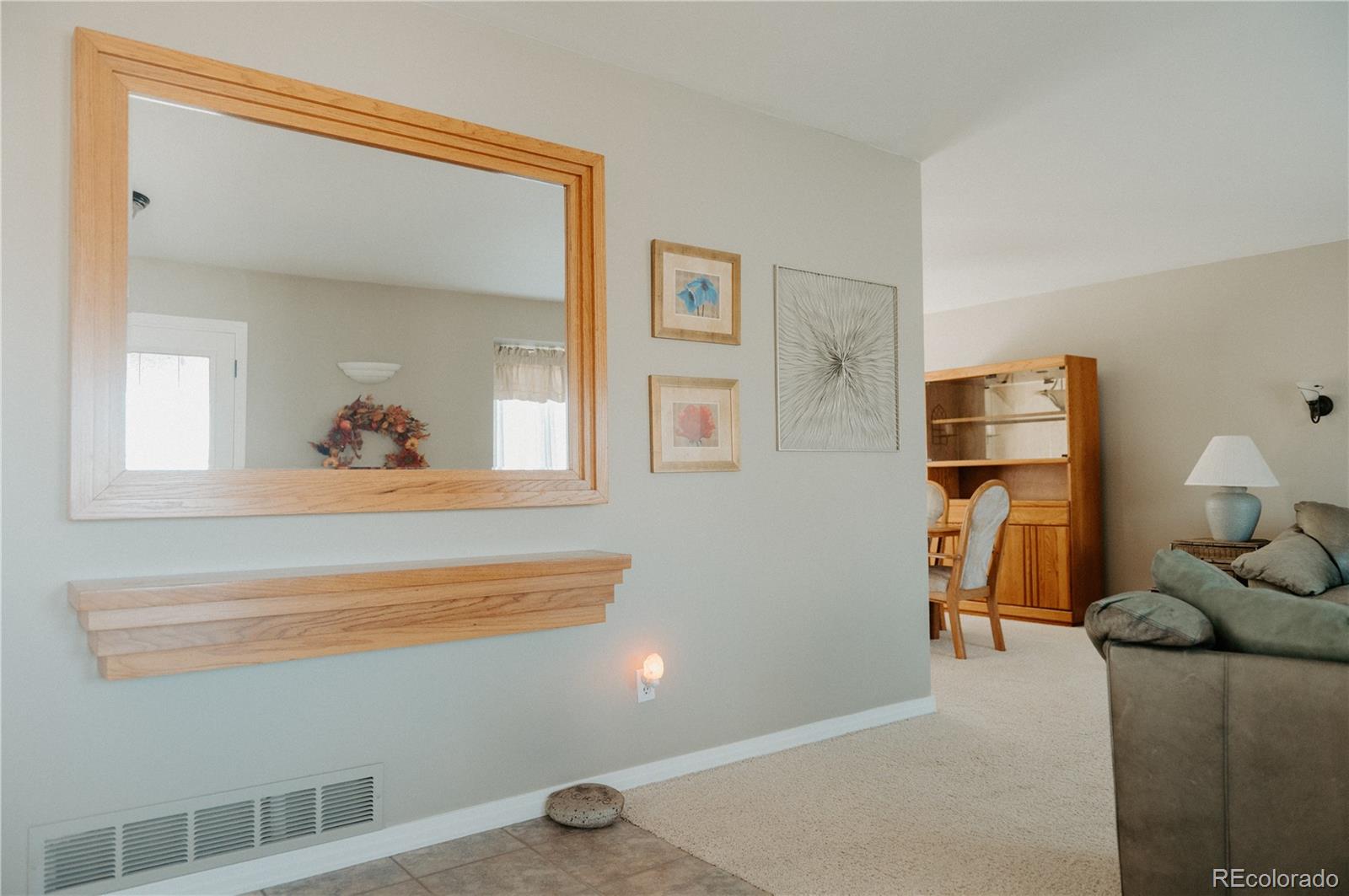 10340 West 100th Place Westminster, CO 80021 - Photo 3 of 25 a living room with furniture and a window