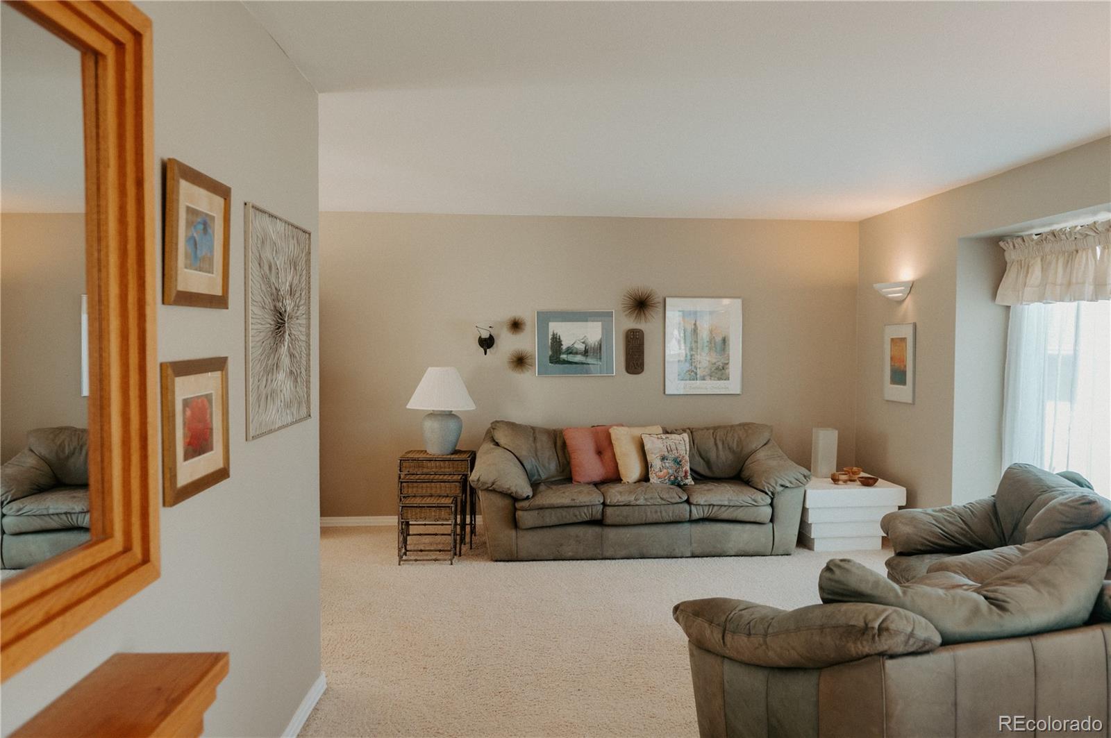 10340 West 100th Place Westminster, CO 80021 - Photo 6 of 25 a living room with furniture and a couch