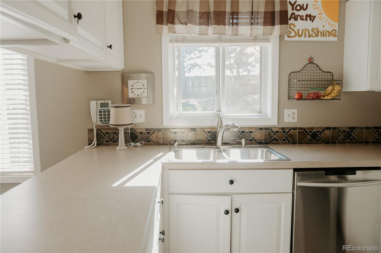 10340 West 100th Place Westminster, CO 80021 - Photo 10 of 25 a bathroom with a sink and a mirror