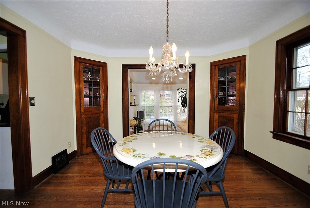 2464 Fenwick Road Cleveland, OH 44118 - Photo 5 of 23 FORMAL DINING ROOM WITH BUILT IN CABINETS AND WOOD FLOORING