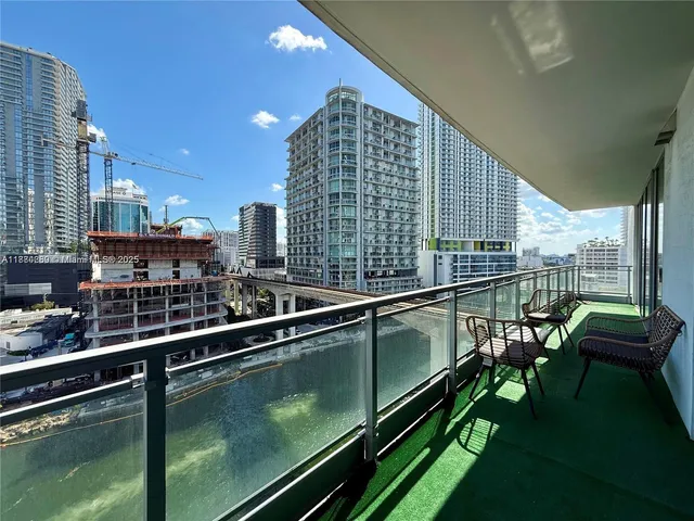 a view of a balcony with chairs