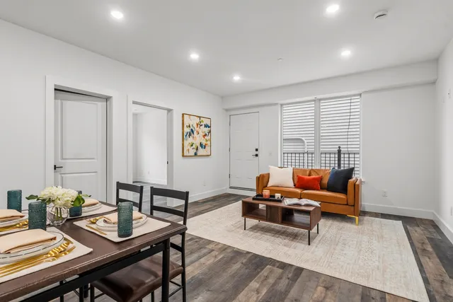a living room with furniture and a rug