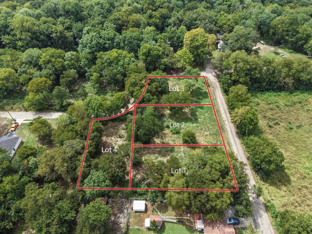 4TH Smith Street Bonham, TX 75418 - Photo 10 of 13 an aerial view of residential house with outdoor space and trees all around