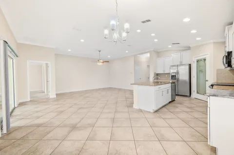 a large kitchen with cabinets and stainless steel appliances