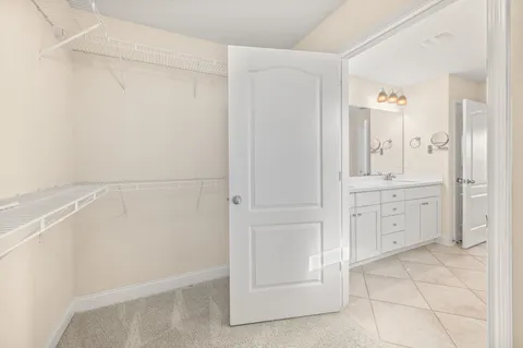 a bathroom with a double vanity sink and mirror