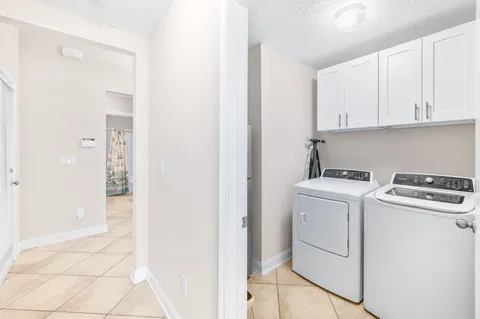 a view of storage and utility room with washer and dryer