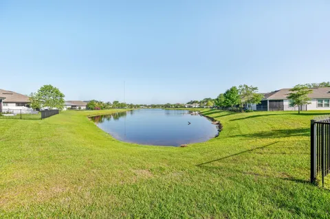 a view of a lake with a big yard