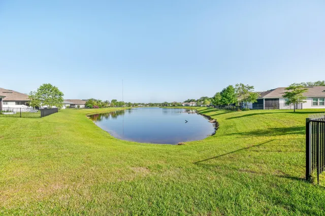 a view of a lake with a big yard