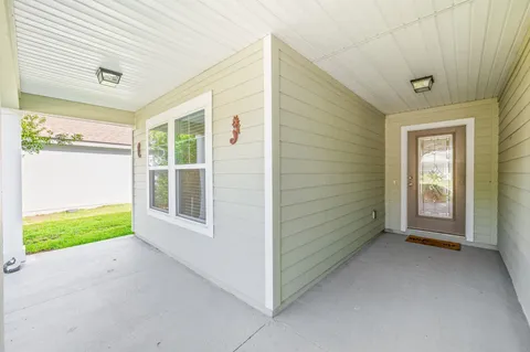 a view of an empty room and a window