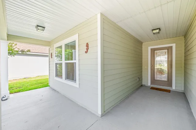 a view of an empty room and a window