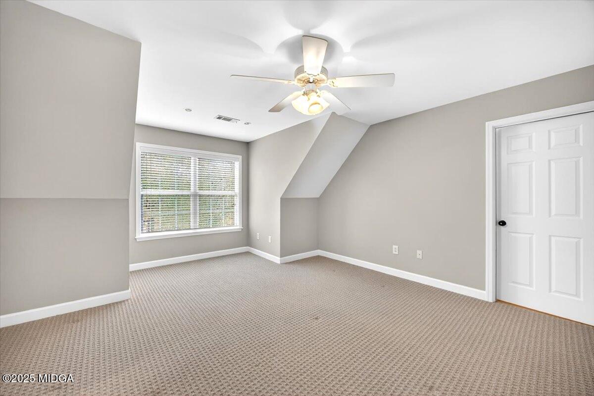 414 Waverly Lane Macon, GA 31210 - Photo 21 of 32 an empty room with windows and fan