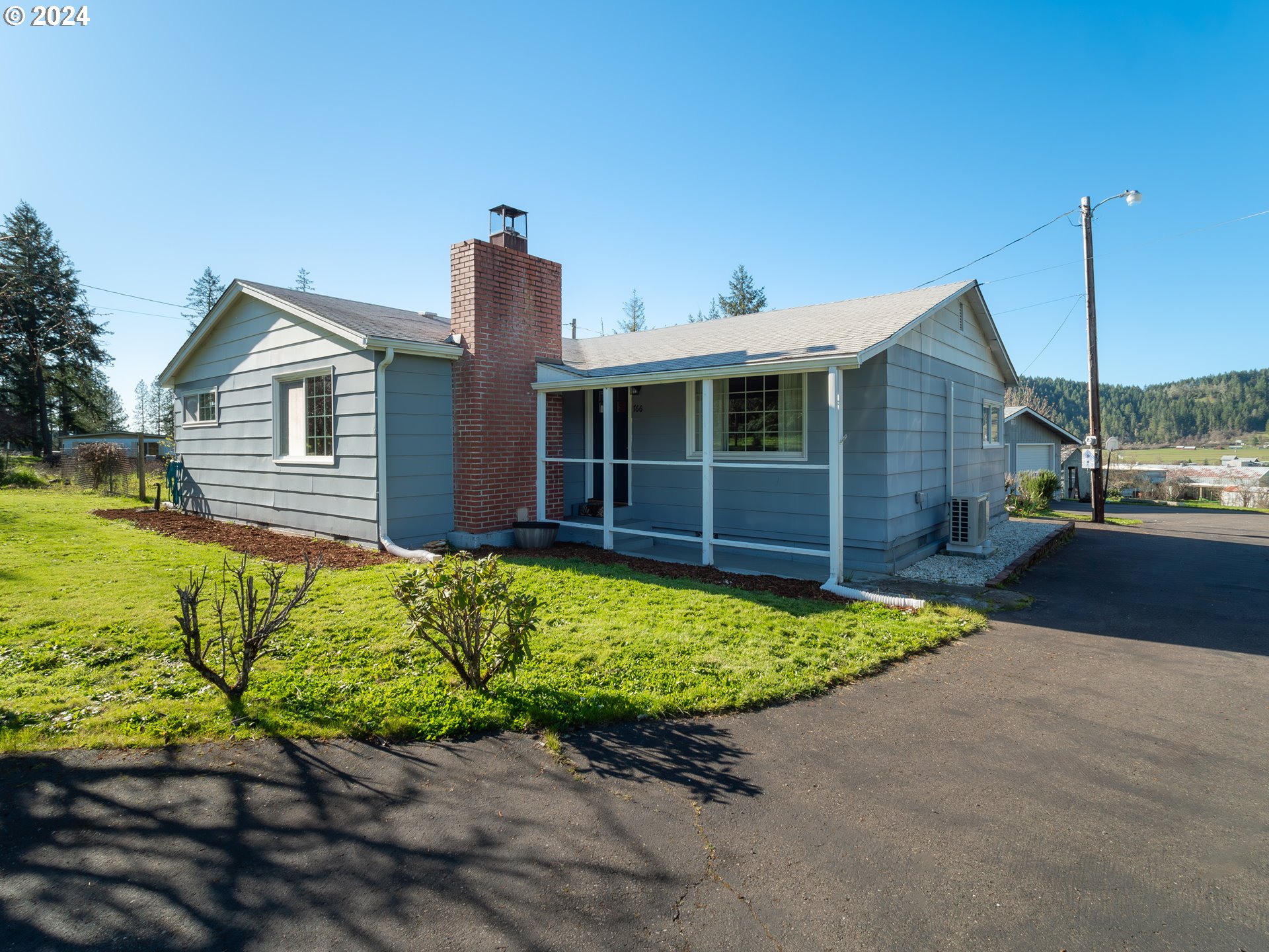 766 Valley View Road Sutherlin, OR 97479 - Photo 1 of 27 a front view of a house with a yard