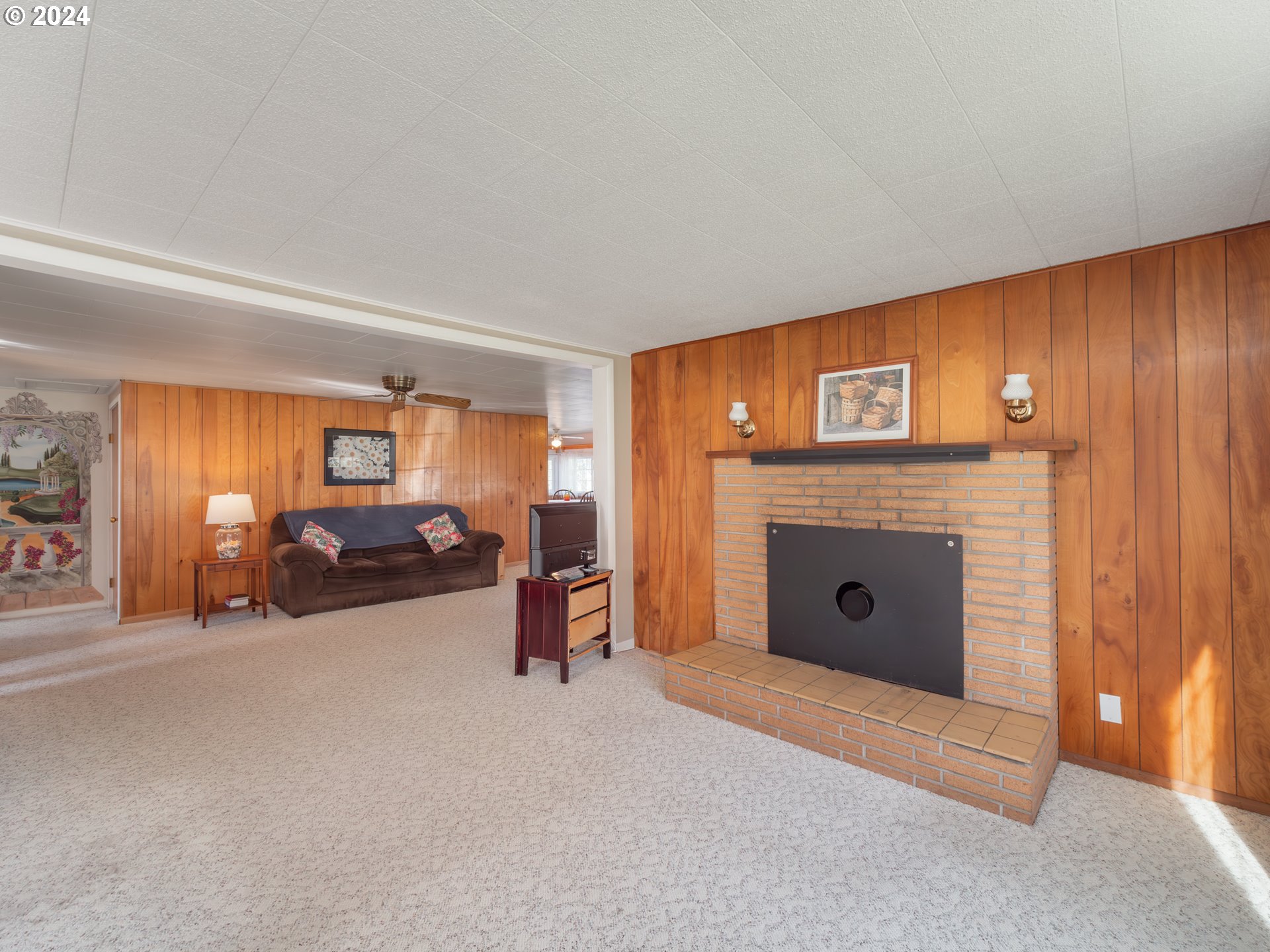 766 Valley View Road Sutherlin, OR 97479 - Photo 7 of 27 a view of a livingroom with furniture and a fireplace