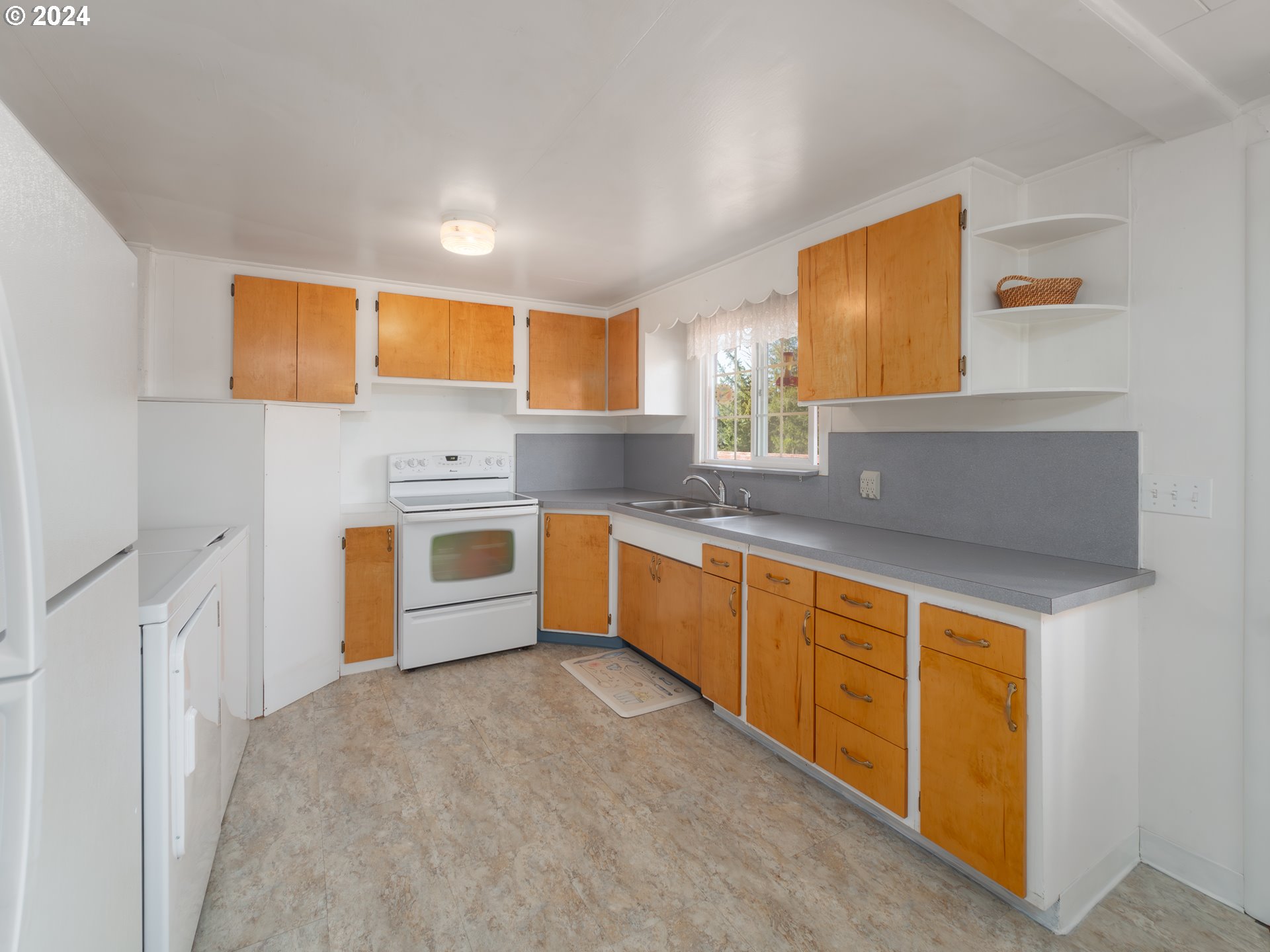 766 Valley View Road Sutherlin, OR 97479 - Photo 9 of 27 a kitchen with stainless steel appliances a sink and a stove
