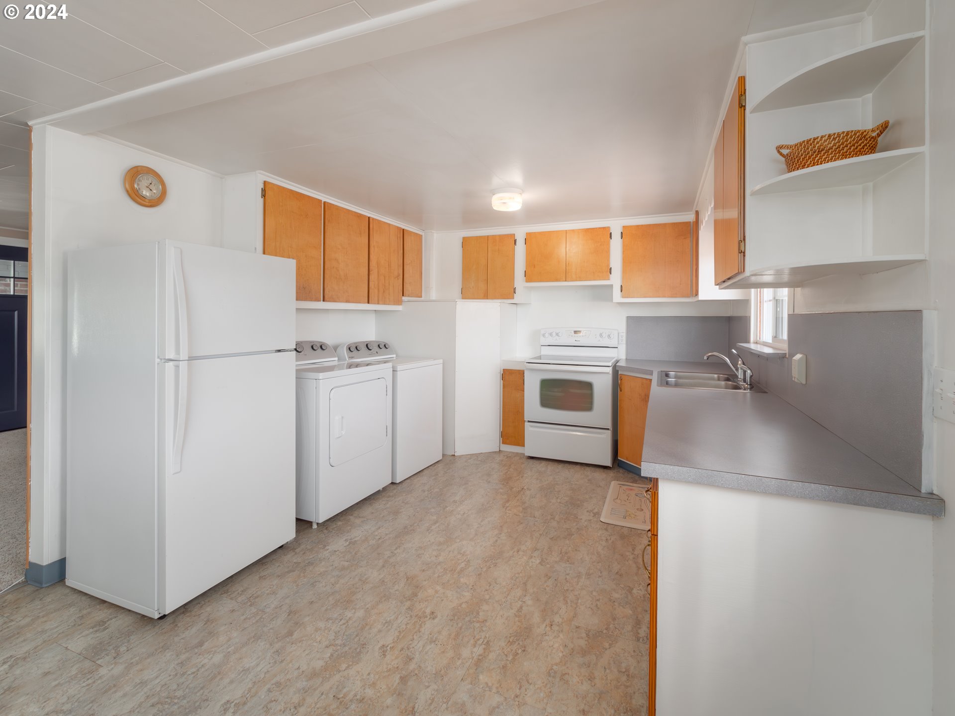 766 Valley View Road Sutherlin, OR 97479 - Photo 10 of 27 a kitchen with stainless steel appliances granite countertop a refrigerator a stove and a sink