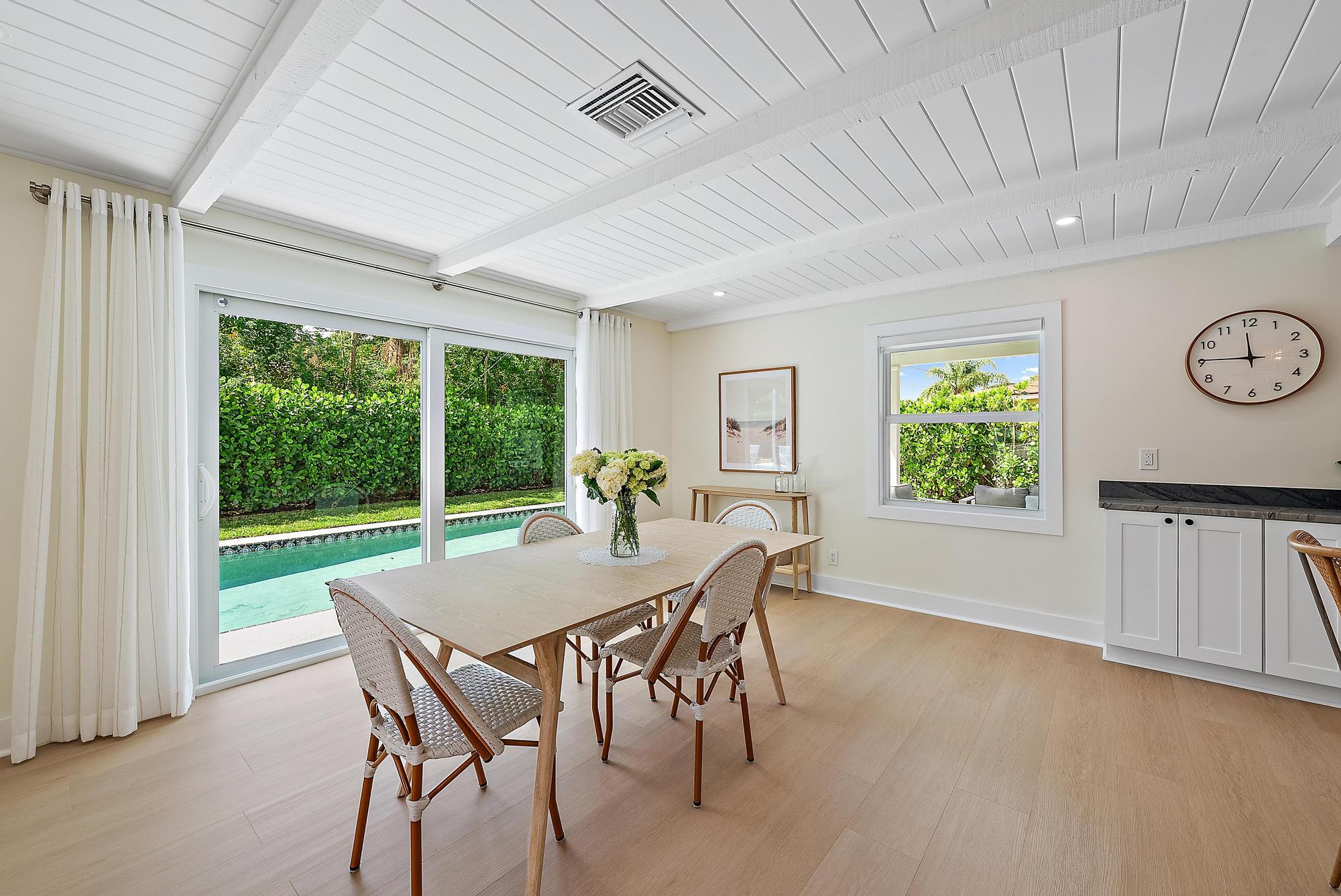 1604 Seabrook Road Tequesta, FL 33469 - Photo 15 of 42 a view of a dining room with furniture window and outside view