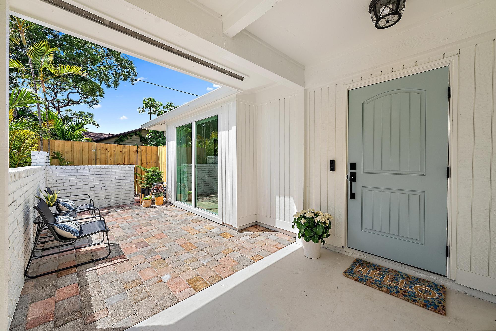 1604 Seabrook Road Tequesta, FL 33469 - Photo 30 of 42 a bedroom with a bed and a window