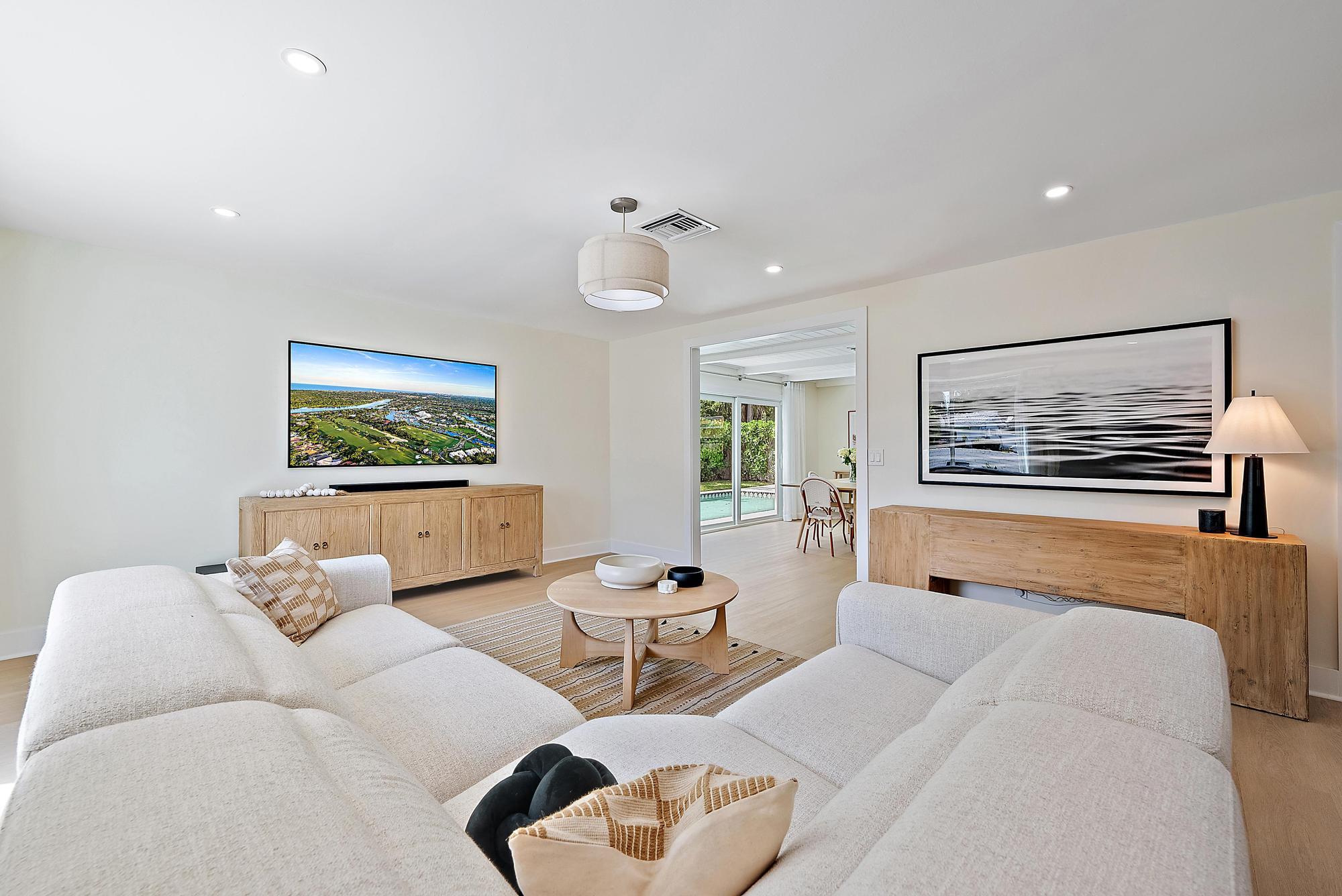 1604 Seabrook Road Tequesta, FL 33469 - Photo 6 of 42 a bedroom with furniture and a flat screen tv