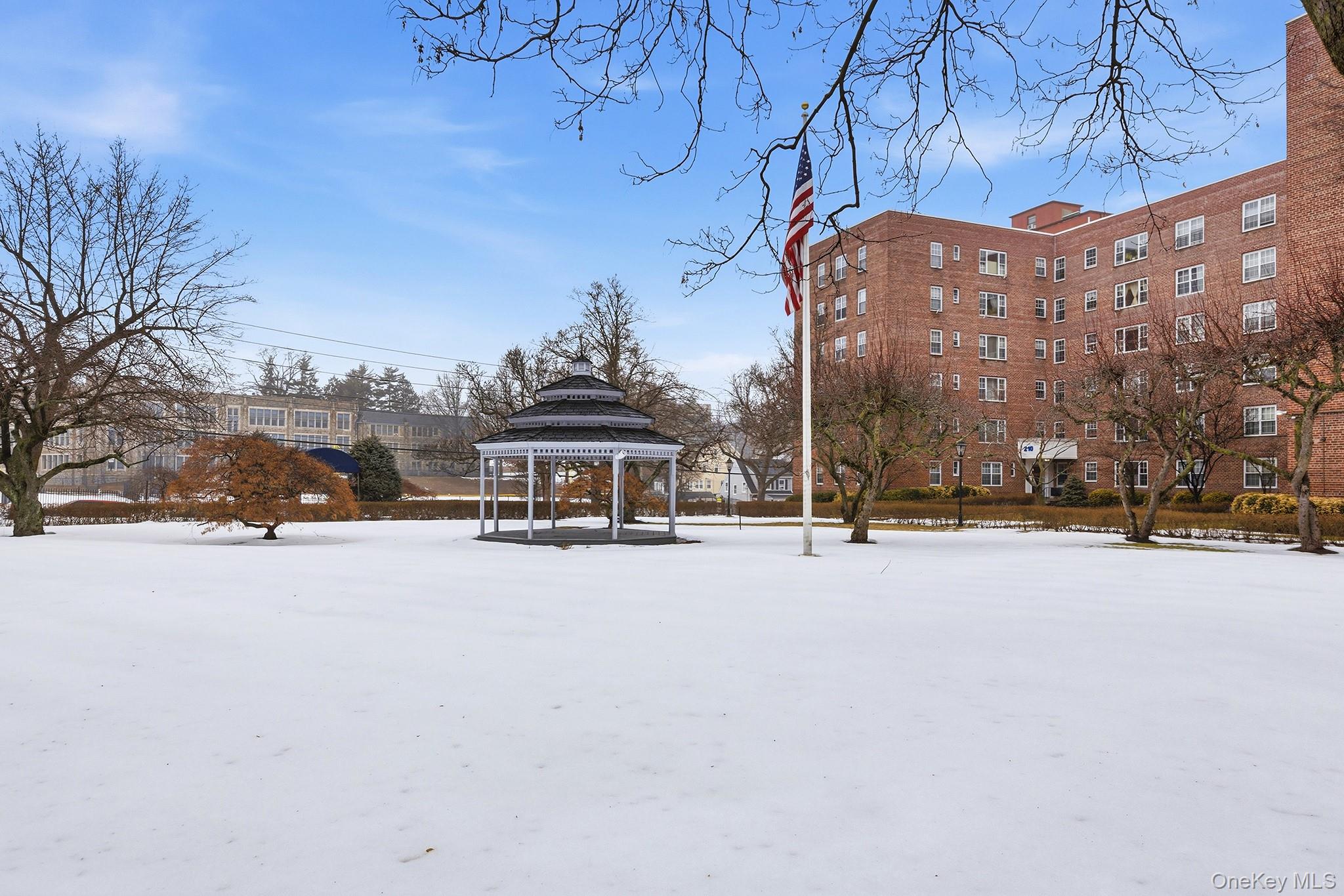 210 Pelham Road, Unit 6E New Rochelle, NY 10805 - Photo 14 of 15 a view of city with tall buildings
