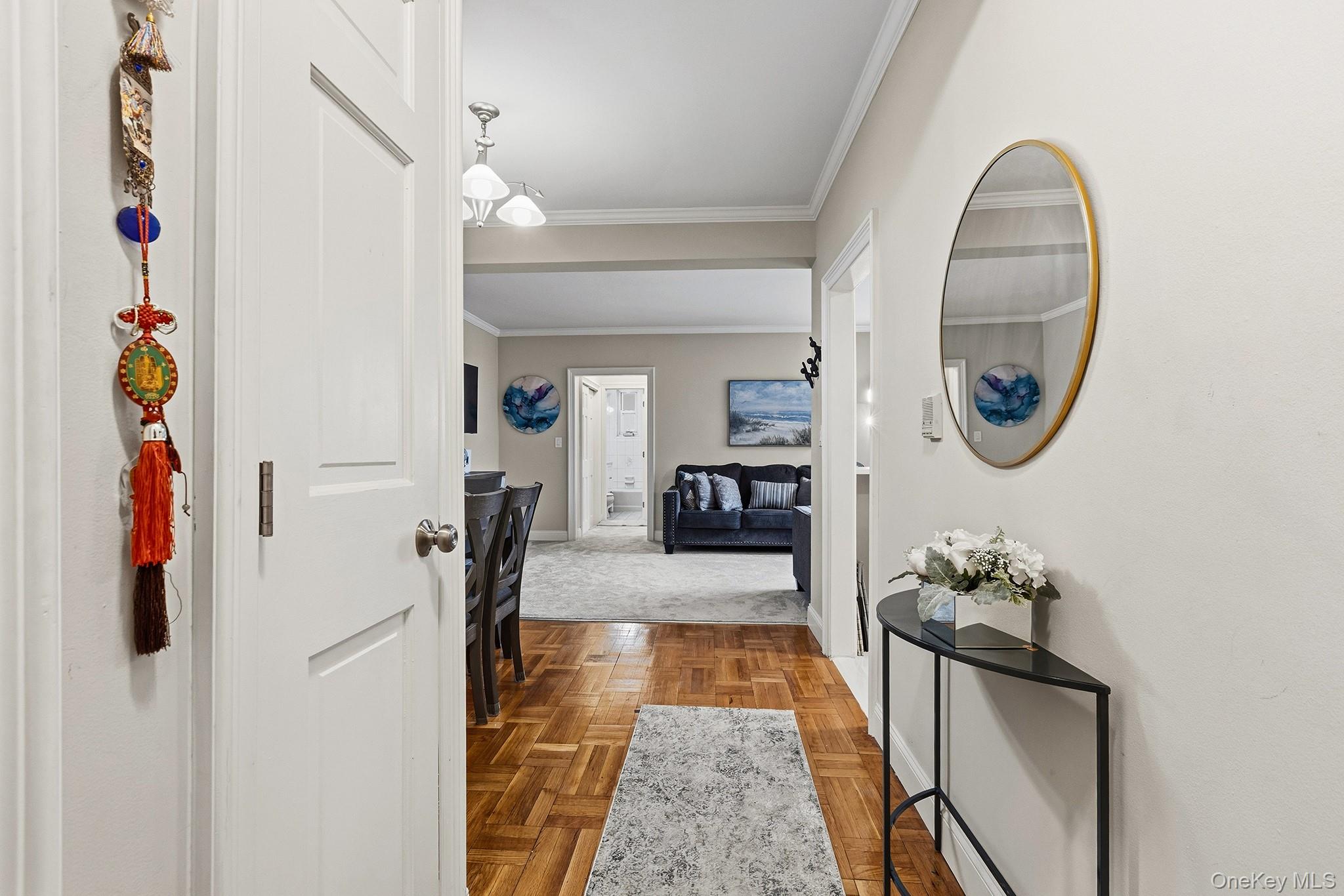 210 Pelham Road, Unit 6E New Rochelle, NY 10805 - Photo 2 of 15 a hallway with painting and a decor